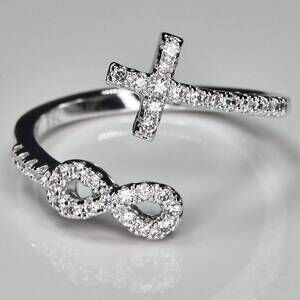 NEW FAIRE infinity cross rhodium plated in silver